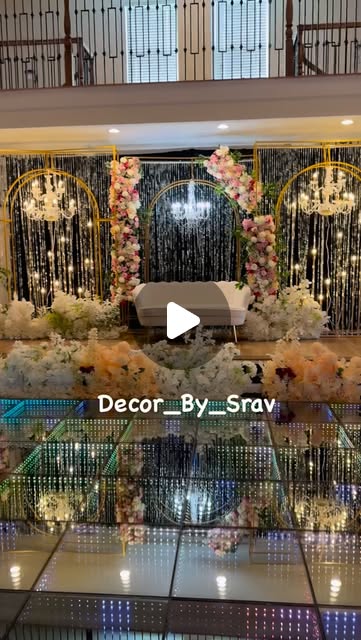 Illuminated mirror dance floor in front of a floral Sangeet stage, from the Decor by Srav Instagram reel